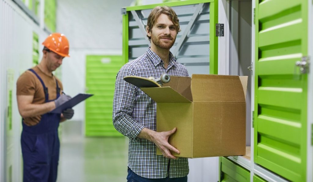 man renting a unit in a storage facility